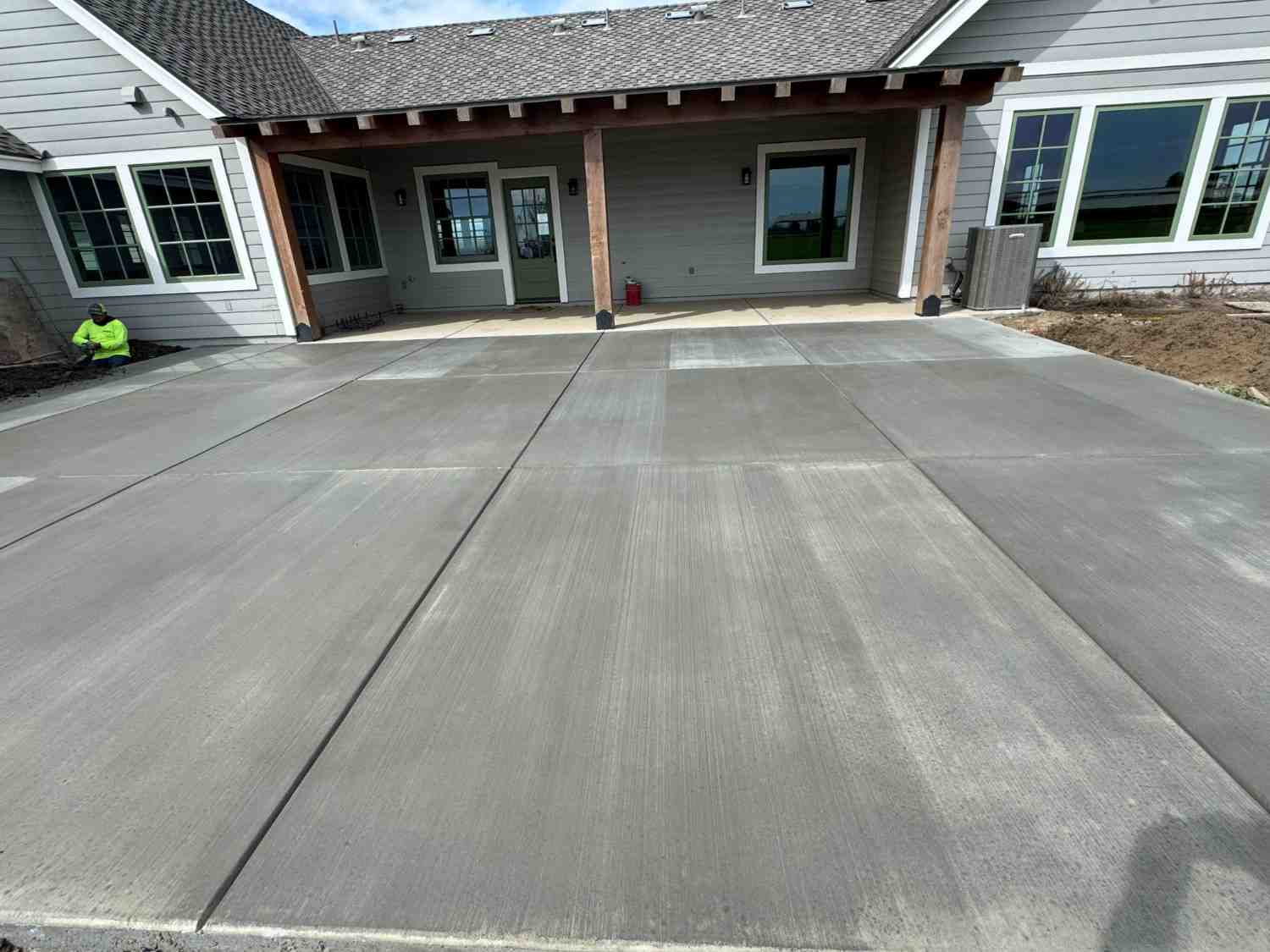 Freshly poured concrete driveway on a residential property