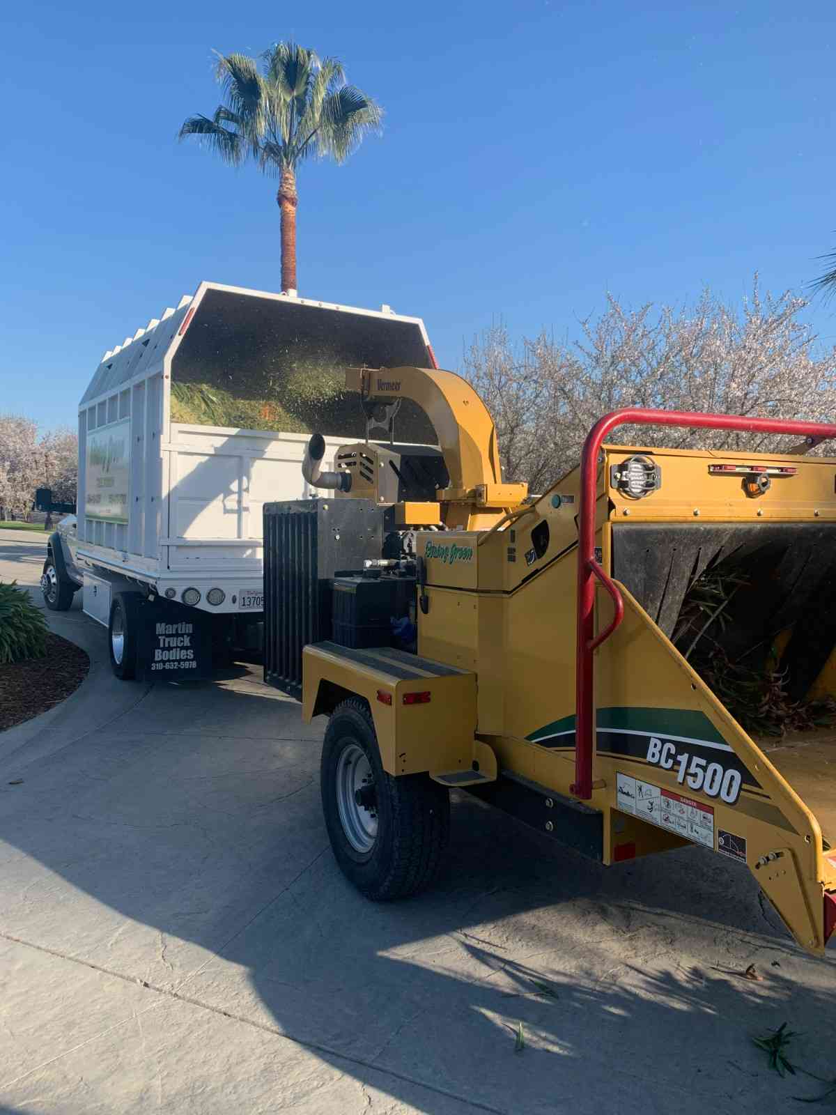 Rising Green wood chipper truck ready for a job