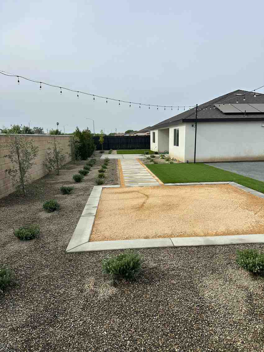 Finished turf and gravel side yard landscaping